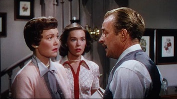 Magnificent Obsession; Helen and Joyce (Jane Wyman and Barbara Rush) learn of the death of their husband and father, Doctor Wayne Phillips.
