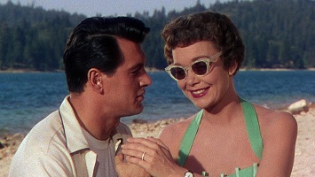 Magnificent Obsession; Bob Merrick (Rock Hudson) befriends Helen Phillips (Jane Wyman) who is unaware of his identity.