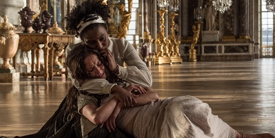 The King's Daughter; the distrught Marie-Josèphe (Kaya Scodelario) is comforted by Magali (Crystal Clarke).