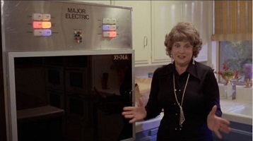 Microwave Massacre; May (Claire Ginsberg) celebrates her X1-74A microwave oven.