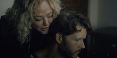 The Portrait; Mags (Virginia Madsen) comforts her injured and unresponsive cousin Alex (Ryan Kwanten).